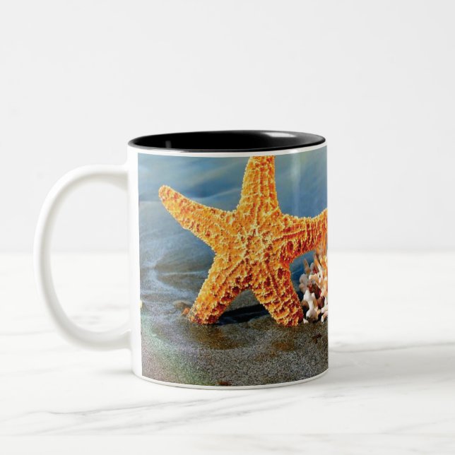 Sea shells and starfish on beach Two-Tone coffee mug (Left)