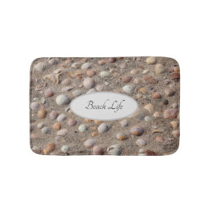 Sea shells at a sandy beach photo with text bath mat