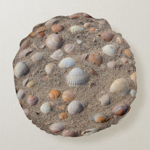 Sea shells at the beach round pillow
