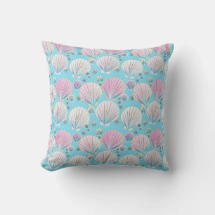 Sea shells on a turquoise blue background throw pillow
