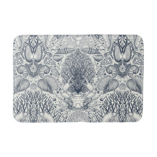 Sea shells on  dark blue bath mat