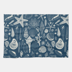 Sea shells on dark blue kitchen towel