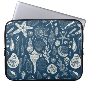 Sea shells on dark blue laptop sleeve