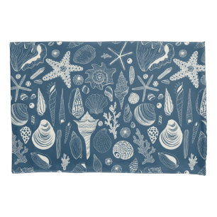 Sea shells on dark blue pillowcase