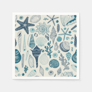 Sea shells on off white napkin
