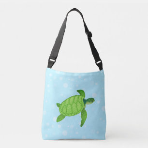 Sea turtle on light blue background crossbody bag