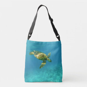 Sea Turtle swimming in turquoise ocean water Crossbody Bag