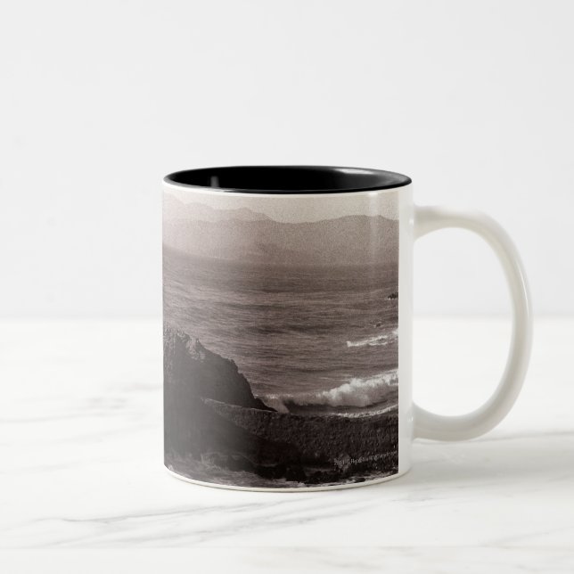 Sea waves crashing against rock Two-Tone coffee mug (Right)