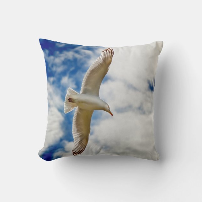 Seagul in flight with blue skies and white cloud, throw pillow (Front)