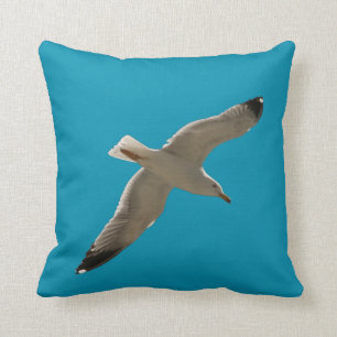 Seagull on a blue sky throw pillow