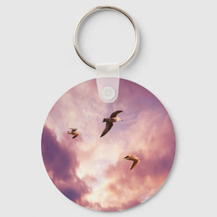 Seagulls flying in a sunset sky keychain