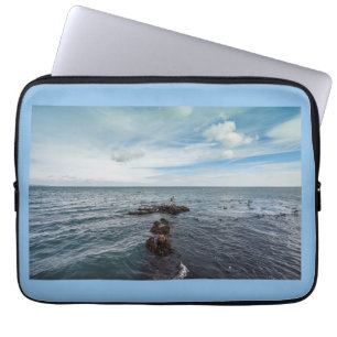 Seagulls flying over the rocks laptop sleeve
