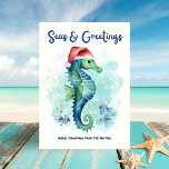 Seahorse Santa Seas & Greetings Nautical Christmas Holiday Card<br><div class="desc">Celebrate the season with coastal charm—this whimsical watercolor seahorse,  donning a Santa hat,  pops against an abstract ocean splash background with the punny “Seas & Greetings” caption. Perfect for beach lovers,  this card brings salty-sweet nautical cheer straight from the sea. ⛱️✨ Art by KL Stock</div>
