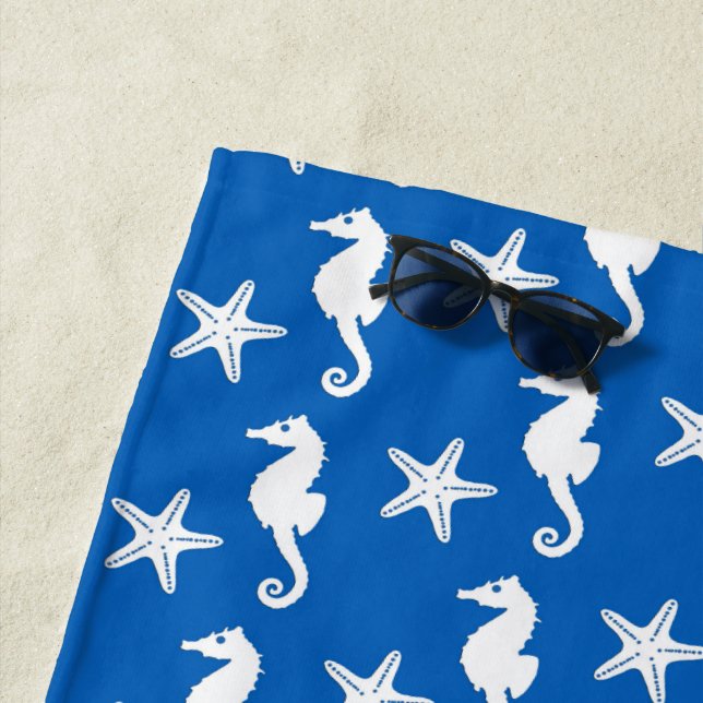 Seahorse & starfish, white on cobalt blue beach towel (In Situ)