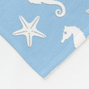 Seahorse & starfish - white on pale blue fleece blanket