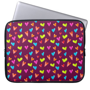 Seamless pattern of multicolored hearts on a purpl laptop sleeve