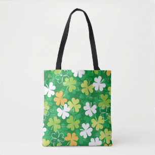 Seamless pattern of scattered clovers and shamrock tote bag