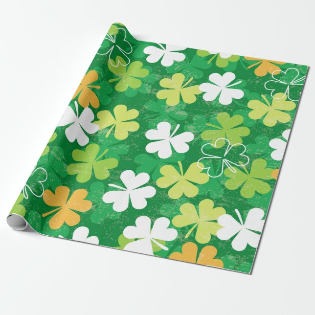 Seamless pattern of scattered clovers and shamrock wrapping paper (Unrolled)
