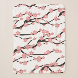 Seamless pattern with blooming cherry on a white b sherpa blanket