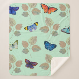 Seamless pattern with bright butterflies and branc sherpa blanket