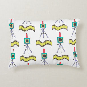 Seamless pattern with cameras and film strips on a accent pillow