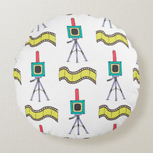 Seamless pattern with cameras and film strips on a round pillow