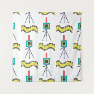 Seamless pattern with cameras and film strips on a tapestry