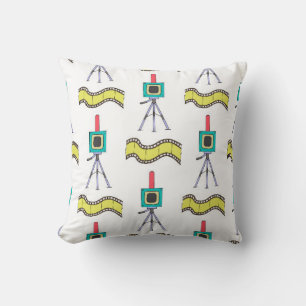 Seamless pattern with cameras and film strips on a throw pillow