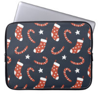 Seamless pattern with christmas socks,candy canes 