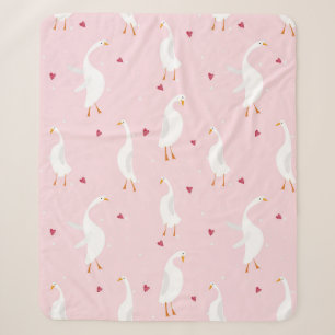 Seamless pattern with cute duck with heart on pink sherpa blanket