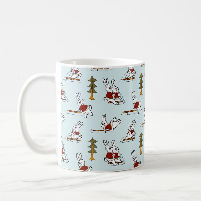 Seamless pattern with different rabbits on sleds i coffee mug (Left)
