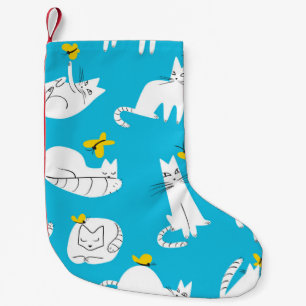 Seamless pattern with funny cats playing with butt small christmas stocking