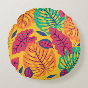 Seamless pattern with tropical leaves on yellow ba round pillow