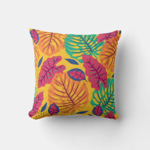 Seamless pattern with tropical leaves on yellow ba throw pillow