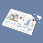 Seas and Greetings Coastal Wood Holiday Photo Jigsaw Puzzle<br><div class="desc">Seas and Greetings Seashell Ornament on Coastal Wood Holiday Photo Puzzle featuring ocean navy blue and sandy tan shell ornaments hanging from sailing jute rope on coastal shiplap wood with elegant typography. Add two of your photos and a personal message for a fun nautical holiday puzzle gift. Please contact us...</div>