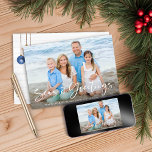 Seas and Greetings | Nautical Holiday Photo<br><div class="desc">Seas and Greetings Nautical Holiday Photo Christmas Cards featuring your photo and our elegant typography. The back showcases our ocean navy blue and sandy tan shell ornaments hanging from sailing jute rope on coastal shiplap wood. Add your and a personal message for a fun nautical holiday card. Please contact us...</div>