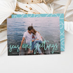 Seas and Greetings | Nautical Holiday Photo Card<br><div class="desc">Send holiday greetings to friends and family in nautical style with these coastal chic holiday photo cards. Design features your favourite photo with "seas and greetings" overlaid in vibrant aqua hand sketched lettering. Personalize with your names, custom greeting (shown with "Merry Christmas") and the year. Cards reverse to a white...</div>