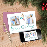 Seas and Greetings Pink Shell Holiday Photo<br><div class="desc">Seas and Greetings Seashell Ornament on Coastal Wood Holiday Photo Christmas Cards featuring blush pink and rose gold and sandy tan shell ornaments hanging from sailing jute rope on coastal shiplap wood with elegant typography. Add two of your photos and a personal message for a fun nautical holiday card. Please...</div>