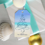 Seas and Greetings Script Christmas Beach Gift Tags<br><div class="desc">Add a coastal vibe to your holiday gifts with these gift tags, featuring the message “Seas & Greetings” with elegant script calligraphy in the shape of a Christmas tree, and an abstract beach background. Please contact me through Zazzle Chat if you need other colorways or design tweaks, or more matching...</div>
