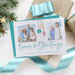 Seas and Greetings Seashell Ornament Holiday Photo<br><div class="desc">Seas and Greetings Seashell Ornament Holiday Photo Christmas Cards featuring turquoise blue and sandy tan shell ornaments hanging from sailing jute rope with elegant typography. Add two of your photos and a personal message for a fun nautical holiday card. Please contact us at cedarandstring@gmail.com if you need assistance with the...</div>