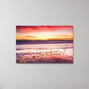 Seascape and pier at sunset, CA Canvas Print