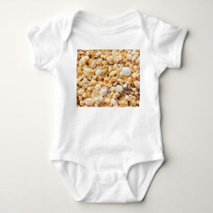 Seashell textured summer beach background. baby bodysuit