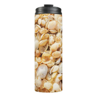 Seashell textured summer beach background. thermal tumbler
