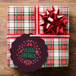 Season greetings in green handwriting with hearts ornament card