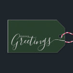 Season's Greetings Green White Minimalist Gift Tags<br><div class="desc">This minimalist and elegant gift tag features white Season's Greetings text on the front side and on the back side personalize it with your name or family name. The background is in green colour.</div>