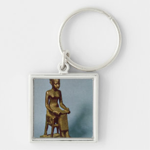 Seated statue of Imhotep  holding an open Keychain