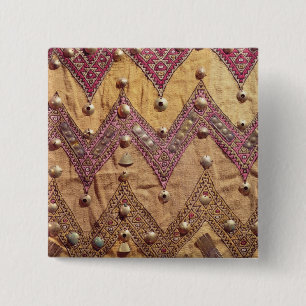 Section of embroidered fabric with gold plaques 2 inch square button