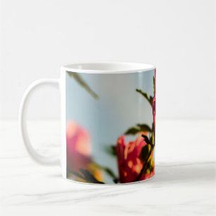 Selective focus photo of pink hibiscus flower coffee mug