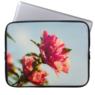 Selective focus photo of pink hibiscus flower laptop sleeve