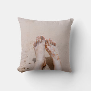 Selective focus photography of feet with tattoo on throw pillow